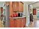 Close-up of cherry cabinetry and granite countertops in a well-appointed kitchen at 245 Maple Shade Dr, Tyrone, GA 30290