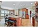 Gourmet kitchen with a large island, stainless steel appliances, and custom cabinetry at 245 Maple Shade Dr, Tyrone, GA 30290