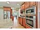 Modern kitchen featuring stainless steel appliances, granite countertops, and custom cabinetry at 245 Maple Shade Dr, Tyrone, GA 30290