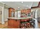 Large kitchen island with bar stool seating, stainless steel appliances, and stone countertops at 245 Maple Shade Dr, Tyrone, GA 30290