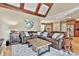 Spacious living room with beamed ceilings and an open layout to the kitchen at 245 Maple Shade Dr, Tyrone, GA 30290