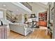 Bright and airy living room with a fireplace, built-in shelving and hardwood floors at 245 Maple Shade Dr, Tyrone, GA 30290