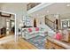 Well-lit living room with hardwood floors and staircase, perfect for entertaining at 245 Maple Shade Dr, Tyrone, GA 30290