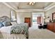 Inviting bedroom featuring neutral colors, tray ceilings, and a spacious layout at 245 Maple Shade Dr, Tyrone, GA 30290