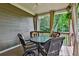 Patio with seating, draped curtains and ceiling fan at 245 Maple Shade Dr, Tyrone, GA 30290