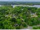 A high angle view of a neighborhood, showing the proximity to the lake and the abundance of mature trees at 4520 Dallas St, Acworth, GA 30101