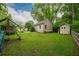 Large, level backyard with playset, storage shed, and oversized two-car garage with plentiful off-street parking at 4520 Dallas St, Acworth, GA 30101