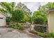 View of the backyard with a basketball hoop, fenced in playground, and luscious landscaping at 4520 Dallas St, Acworth, GA 30101