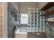 Modern bathroom features a tub, glass block, and unique wall tile at 4520 Dallas St, Acworth, GA 30101