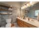 Bathroom with double vanity, decorative lighting, and a decorative mirror at 4520 Dallas St, Acworth, GA 30101