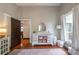 Bedroom area featuring a dresser, hardwood floors, neutral paint, and a glimpse into an adjoining room at 4520 Dallas St, Acworth, GA 30101