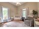 Cozy bedroom featuring lots of natural light, a crib, and an armchair at 4520 Dallas St, Acworth, GA 30101