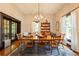 Bright dining room boasts hardwood floors, modern chandelier, and large windows with natural light at 4520 Dallas St, Acworth, GA 30101