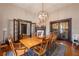 Formal dining room showcasing a wooden table, chandelier, and classic architectural details at 4520 Dallas St, Acworth, GA 30101