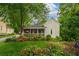 Charming home featuring a screened-in porch and beautifully landscaped yard at 4520 Dallas St, Acworth, GA 30101