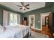 Beautiful bedroom features hardwood floors, decorative rug, and a ceiling fan at 4520 Dallas St, Acworth, GA 30101