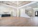 Open concept living room with high ceilings, hardwood floors and adjoined kitchen at 0 Thompson Mill Rd, Buford, GA 30519