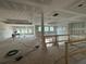 Spacious living room featuring tray ceilings and staircase, offering a grand and open living space at 0 Thompson Mill Rd, Buford, GA 30519
