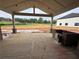 Outdoor patio area with a fireplace and expansive views of the surrounding landscape at 0 Thompson Mill Rd, Buford, GA 30519