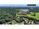 Aerial view featuring the home with a view of West Point Lake in the background at 102 Plantation Dr, Lagrange, GA 30277