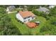 Aerial view of the backyard showing a two-story home with a wooden deck and gazebo at 102 Plantation Dr, Lagrange, GA 30277