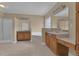 Large bathroom with double sink vanities, large tub, shower, and tile floors provides a spa-like experience at 102 Plantation Dr, Lagrange, GA 30277