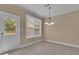 Cozy breakfast nook with tile flooring, natural light, and access to the outdoor deck at 102 Plantation Dr, Lagrange, GA 30277