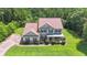 Charming two-story home surrounded by lush greenery and trees at 102 Plantation Dr, Lagrange, GA 30277