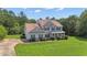 Beautiful two-story home featuring a well-manicured lawn and driveway at 102 Plantation Dr, Lagrange, GA 30277
