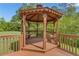 A beautiful wood gazebo is the perfect place to relax or entertain in your private backyard at 102 Plantation Dr, Lagrange, GA 30277