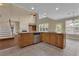 Open-concept kitchen with island, stainless appliances, and views of the living room at 102 Plantation Dr, Lagrange, GA 30277