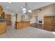Open kitchen featuring an island, tile floor, and seamlessly flowing into the living room at 102 Plantation Dr, Lagrange, GA 30277