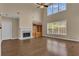 Bright living room with hardwood floors, a fireplace, and a large window at 102 Plantation Dr, Lagrange, GA 30277