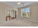 Bright living room with plush carpet, neutral paint, and large window at 102 Plantation Dr, Lagrange, GA 30277