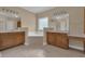 Main bathroom featuring dual vanities, a soaking tub, and tile flooring at 102 Plantation Dr, Lagrange, GA 30277