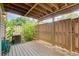Covered deck featuring a privacy fence and lush landscaping for outdoor enjoyment at 1301 Parkaire Xing, Marietta, GA 30068