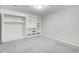Finished basement space offers versatile built-in shelving for storage or personalization at 1301 Parkaire Xing, Marietta, GA 30068