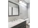 Modern bathroom with a stylish vanity, framed mirror, and contemporary lighting at 1301 Parkaire Xing, Marietta, GA 30068
