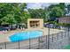 Community pool featuring lounge chairs, shady areas, and a clear blue pool at 1301 Parkaire Xing, Marietta, GA 30068