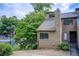 Charming townhouse featuring a cozy front entrance and well-maintained landscaping at 1301 Parkaire Xing, Marietta, GA 30068