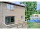 Exterior angle of a home's deck overlooking a pool and tennis court, with mature trees in the background at 1301 Parkaire Xing, Marietta, GA 30068