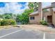 Front exterior of the townhome featuring a mulch bed, siding, and convenient parking at 1301 Parkaire Xing, Marietta, GA 30068