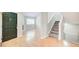 Inviting foyer showcasing a staircase and hardwood floors, creating a welcoming entrance at 1301 Parkaire Xing, Marietta, GA 30068