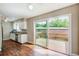 Bright kitchen boasts stainless appliances and wood floors, leading to a spacious outdoor deck at 1301 Parkaire Xing, Marietta, GA 30068