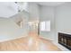 Spacious living room with hardwood floors, fireplace, and soaring ceilings at 1301 Parkaire Xing, Marietta, GA 30068