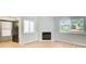 Inviting living area featuring a cozy fireplace, neutral paint, and hardwood floors at 1301 Parkaire Xing, Marietta, GA 30068