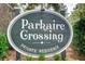 Community sign reading Parkaire Crossing Private Residence nestled among lush greenery at 1301 Parkaire Xing, Marietta, GA 30068