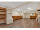 Spacious basement with vinyl flooring, recessed lights, and a brick fireplace at 1618 Mason Mill Ne Rd, Atlanta, GA 30329