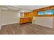 Renovated basement featuring wood paneling and flooring with a small window at 1618 Mason Mill Ne Rd, Atlanta, GA 30329