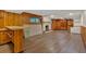 Finished basement featuring wood-paneled walls, a white brick fireplace, and vinyl flooring at 1618 Mason Mill Ne Rd, Atlanta, GA 30329